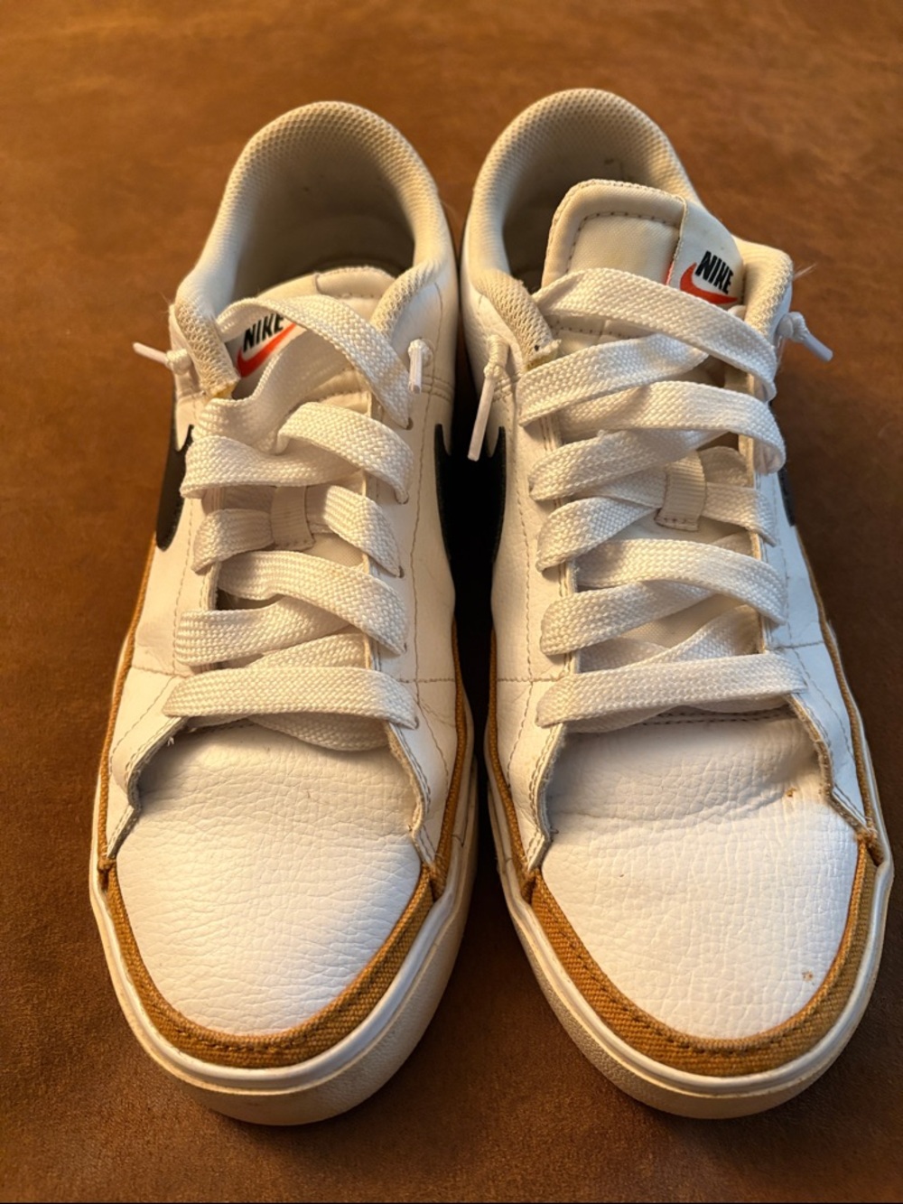 Nike Women’s White Sneakers with Black Swoosh and Tan Accents